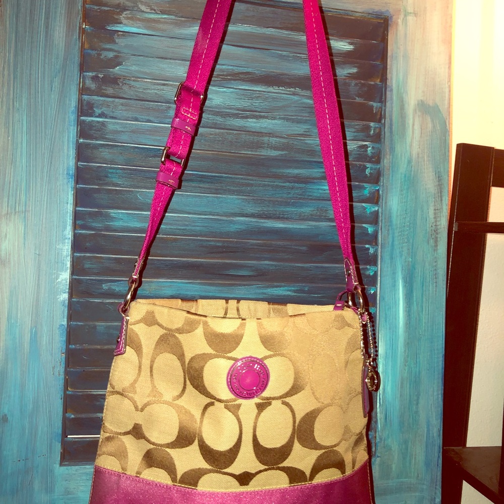 Cute Coach messenger bag with fuchsia accents
